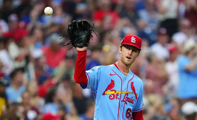 St. Louis Cardinals pitcher Quinn Mathews receives a new ball after giving up a RBI-double to Philadelphia Phillies' Derek Hill during the third inning of a baseball game, Saturday, Aug. 22, 2026, in Philadelphia. (AP Photo/Derik Hamilton)