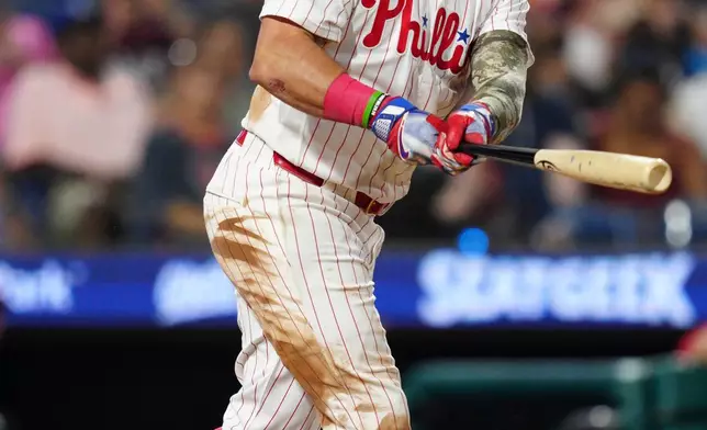Philadelphia Phillies' Kyle Schwarber watches his solo home run off St. Louis Cardinals' Pedro Pagés during the eighth inning of a baseball game, Saturday, Aug. 22, 2026, in Philadelphia. (AP Photo/Derik Hamilton)