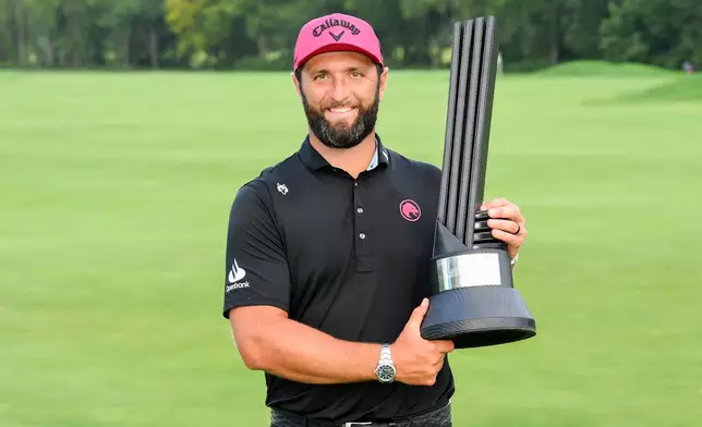 LIV Golf season-long champion captain Jon Rahm, of Legion XIII, poses with the trophy after the final round of LIV Golf Indianapolis, Sunday, Aug. 23, 2026, in Westfield, Ind. (Montana Pritchard/LIV Golf via AP)