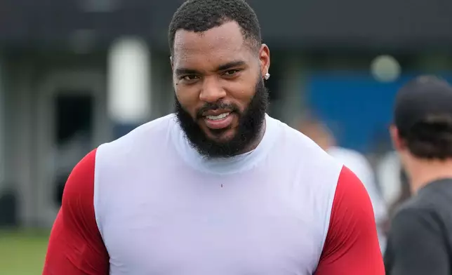 Tennessee Titans defensive tackle Jeffery Simmons walks off the field after practice during the NFL football team's training camp Tuesday, Aug. 4, 2026, in Nashville, Tenn. (AP Photo/George Walker IV)
