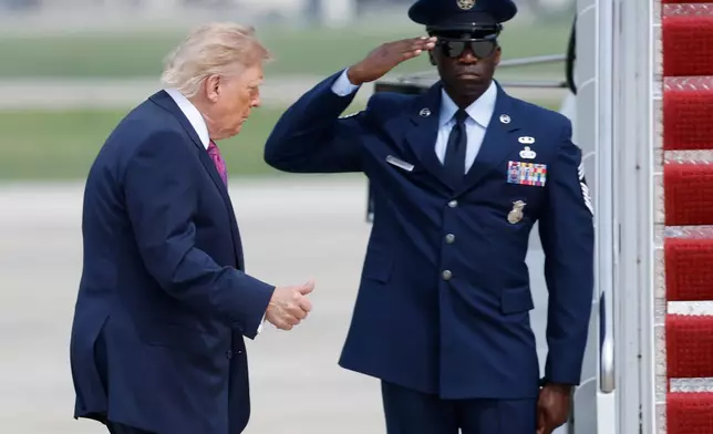 President Donald Trump, left, gestures as he walks from Marine One to board Air Force One, during his departure at Joint Base Andrews, Md., Thursday, August. 27, 2026. (AP Photo/Luis M. Alvarez)
