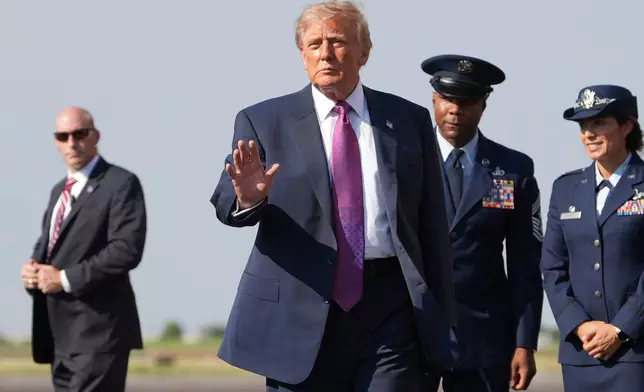 President Donald Trump arrives on Air Force One, Thursday, Aug. 27, 2026, at Ellington Airport in Houston. (AP Photo/Mark Schiefelbein)