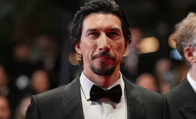 FILE - Adam Driver poses for photographers upon arrival at the premiere of the film 'Paper Tiger' at the 79th international film festival, Cannes, southern France, Saturday, May 16, 2026. (Photo by Scott A Garfitt/Invision/AP, File)
