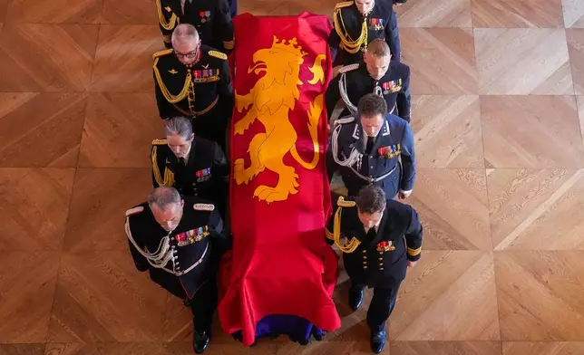 Norway's King Harald V's coffin is moved by King Harald's family and court staff from the Red Salon to the Palace Chapel in Oslo, Monday, Aug. 31, 2026. (Javad Parsa/Pool Photo via AP)