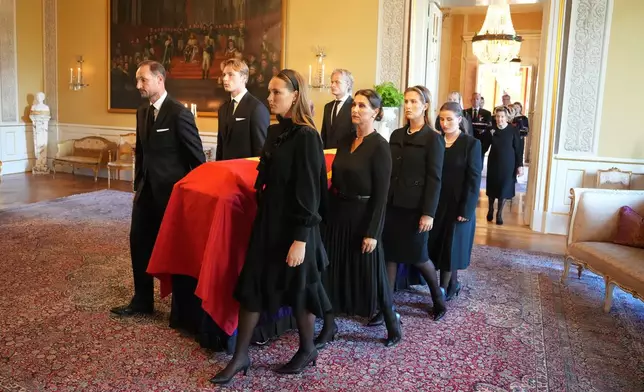 King Harald V's coffin is moved from the Red Salon to the Palace Chapel, in Oslo, Monday, Aug. 31, 2026. (Ole Berg-Rusten/NTB Scanpix via AP)