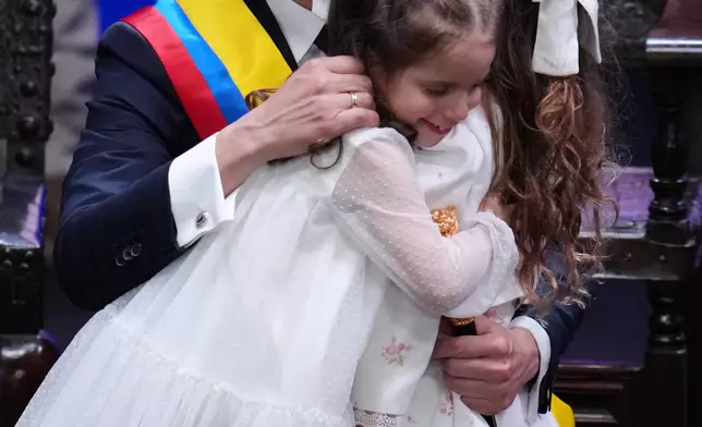 Colombia's President Abelardo de la Espriella, embraces his daughter Francesca after he took the oath of office in Cali, Colombia, Friday, Aug. 7, 2026. (AP Photo/Matias Delacroix)