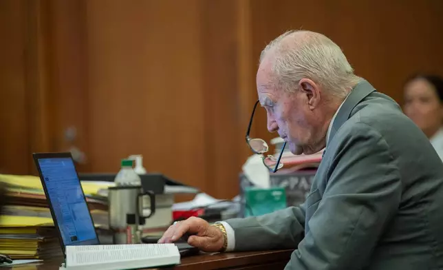 Attorney Kevin Reddington works on his computer as prosecutors cross examine psychologist Dr. Paul Zeizel during Lindsay Clancy's murder trial Wednesday, Aug. 19, 2026, in Plymouth, Mass. (Amanda Sabga/The Boston Herald via AP, Pool)