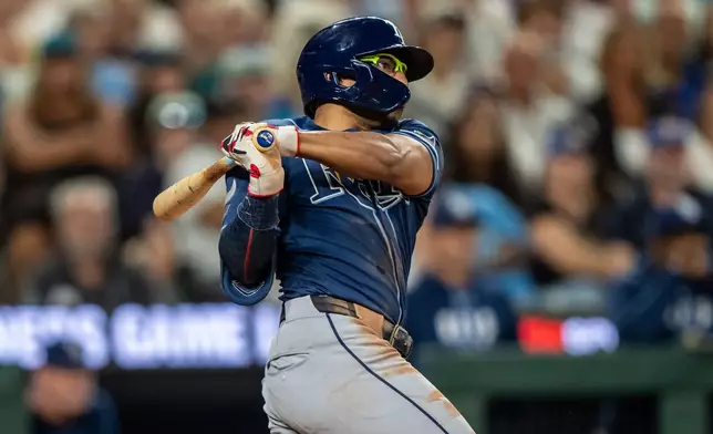 Tampa Bay Rays' Richie Palacios hits a two-run single during the sixth inning of a baseball game against the Seattle Mariners, Saturday, Aug. 8, 2026, in Seattle. (AP Photo/Stephen Brashear)