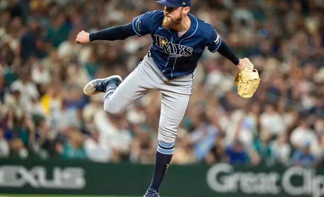 Tampa Bay Rays relief pitcher Bryan Baker delivers a pitch during the ninth inning of a baseball game against the Seattle Mariners, Saturday, Aug. 8, 2026, in Seattle. (AP Photo/Stephen Brashear)