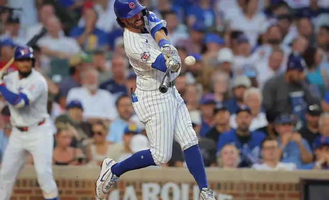 Chicago Cubs' Dansby Swanson hits a home run during the third inning of a baseball game against the Los Angeles Dodgers, Tuesday, Aug. 4, 2026, in Chicago. (AP Photo/Melissa Tamez)