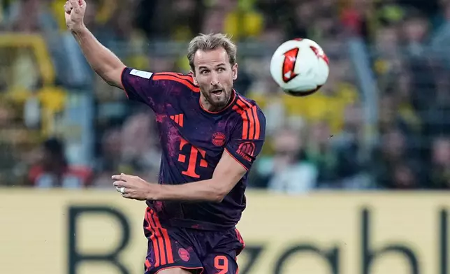 Bayern's Harry Kane kicks the ball during the Franz Beckenbauer German Supercup soccer match between Borussia Dortmund and Bayern Munich in Dortmund, Germany, Saturday, Aug. 22, 2026. (AP Photo/Martin Meissner)