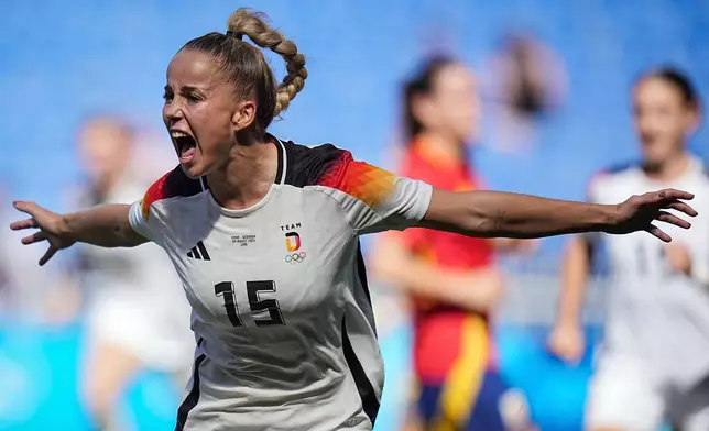 FILE - Germany's Giulia Gwinn celebrates after scoring during the women's bronze medal soccer match between Spain and Germany, at the Lyon stadium, during the 2024 Summer Olympics, Friday, Aug. 9, 2024, in Decines, France. (AP Photo/Laurent Cipriani, File)