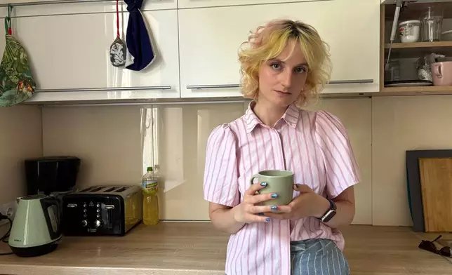 Nastya Podorozhnya stands in the kitchen of the shelter which the Martynka non-profit is running in Krakow, Poland, Thursday, July 2, 2026. (AP Photo/Claudia Ciobanu)