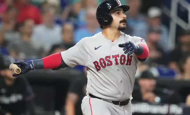 Boston Red Sox's Mickey Gasper watches after hitting a solo home run during the second inning of a baseball game against the Miami Marlins, Tuesday, Aug. 25, 2026, in Miami. (AP Photo/Lynne Sladky)