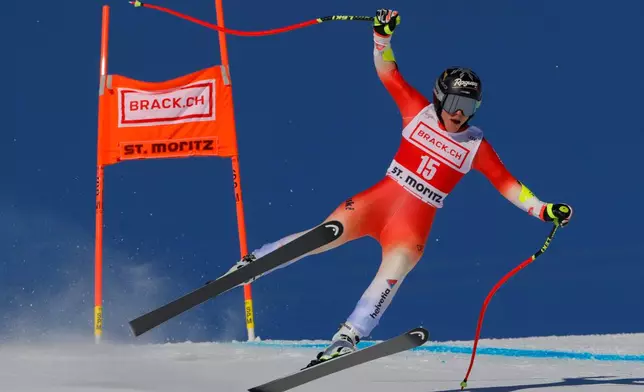 FILE - Switzerland's Lara Gut Behrami speeds down the course during an alpine ski, women's World Cup downhill training, in St. Moritz, Switzerland, Thursday, Dec. 7, 2023. (AP Photo/Giovanni Pizzato, File)