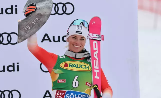 FILE - Switzerland's Lara Gut Behrami celebrates taking third place in an alpine ski, women's World Cup giant slalom, in Soelden, Austria, Saturday, Oct. 25, 2025. (AP Photo/Marco Trovati, File)