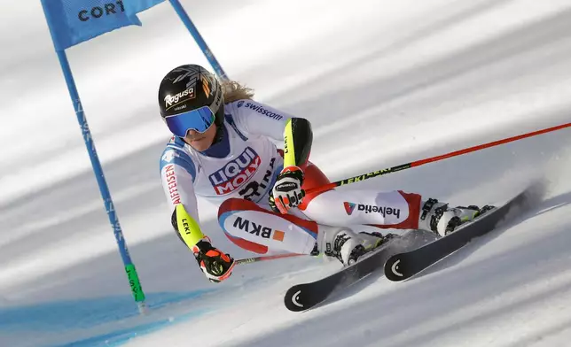 FILE - Switzerland's Lara Gut-Behrami speeds down the course on her way to win a women's giant slalom, at the alpine ski World Championships, in Cortina d'Ampezzo, Italy, Thursday, Feb. 18, 2021. (AP Photo/Gabriele Facciotti, File)