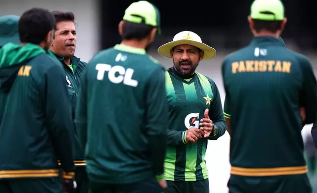 Pakistan's head coach Sarfaraz Ahmed, center speaks during a nets session in Leeds, England, Tuesday, Aug. 18, 2026 ahead of the in the first Men's Rothesay Test Match between England and Pakistan starting Wednesday. (Bradley Collyer/PA via AP)