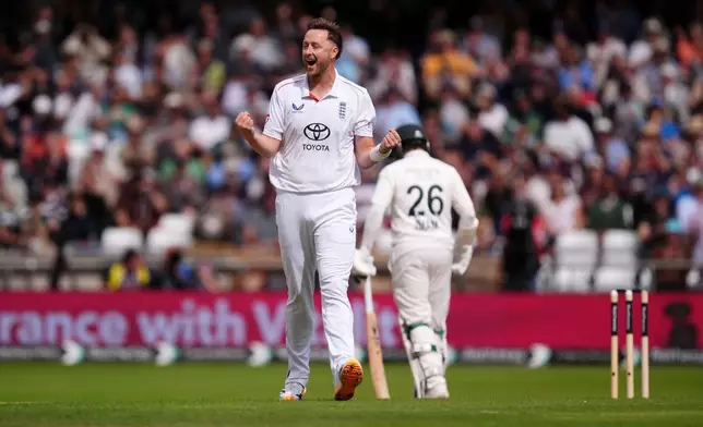 England's Ollie Robinson celebrates bowling out Pakistan's Azan Awais on day one of the first Rothesay Test match between England and Pakistan in Leeds, England, Wednesday, Aug. 19, 2026. (Mike Egerton/PA via AP)