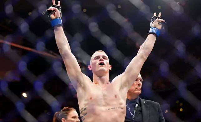 FILE - Ian Machado Garry celebrates a win against Neil Magny during a UFC 292 mixed martial arts fight, Saturday, August 19, 2023, in Boston. (AP Photo/Gregory Payan, file)