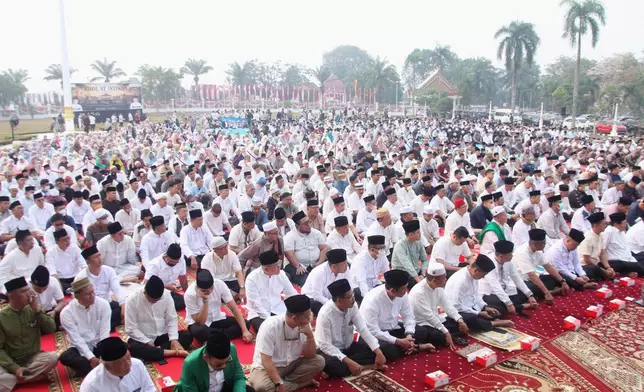 Indonesian Muslims attend a prayer requesting for rain following wildfires that burn through peatlands in several regions in Sumatra and Kalimantan Island, in Palembang, South Sumatra, Indonesia, Tuesday, Aug. 25, 2026. (AP Photo/Muhammad Fajri)