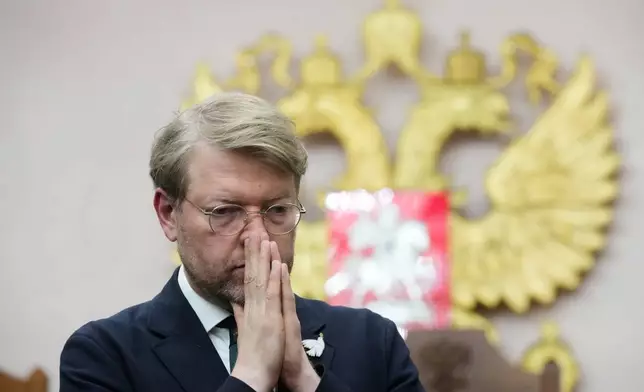 Yabloko party leader Nikolai Rybakov stands after a hearing on a lawsuit to bar the party from the upcoming parliamentary elections, at the Russia's Supreme Court, in Moscow, Monday, Aug. 10, 2026. (AP Photo/Pavel Bednyakov)