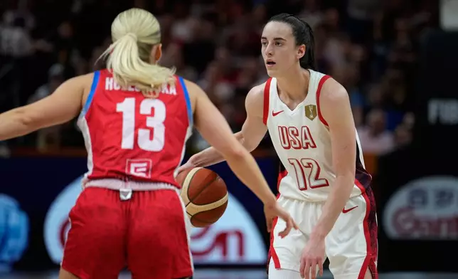 Czechia's Petra Holesinska guards Caitlin Clark, of the United States, during the Women's Basketball World Cup match between the United States and Czechia in Berlin, Monday, Sept. 7, 2026. (AP Photo/Ebrahim Noroozi)