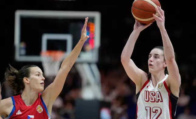 Caitlin Clark, of the United States, shoots over Czechia's Veronika Vorackova during the Women's Basketball World Cup match between the United States and Czechia in Berlin, Monday, Sept. 7, 2026. (AP Photo/Ebrahim Noroozi)