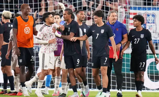 Members of United States and Chile scuffle near the end of their international friendly soccer match Tuesday, Sept. 29, 2026, in St. Louis. (AP Photo/Jeff Roberson)