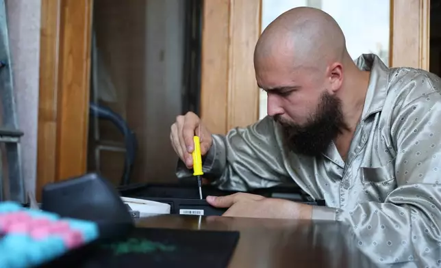 A 28-year-old digital content marketer who recently moved out of Russia is seen in Tbilisi, Georgia, Saturday, Sept. 5, 2026. He asked not to be identified because of security concerns. (AP Photo/Zurab Tsertsvadze)