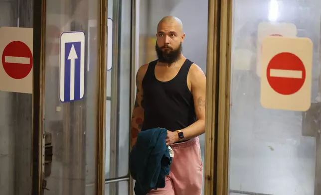A 28-year-old digital content marketer who recently moved out of Russia enters the subway in Tbilisi, Georgia, on Tuesday, Sept. 8, 2026. He asked not to be identified because of security concerns. (AP Photo/Zurab Tsertsvadze)