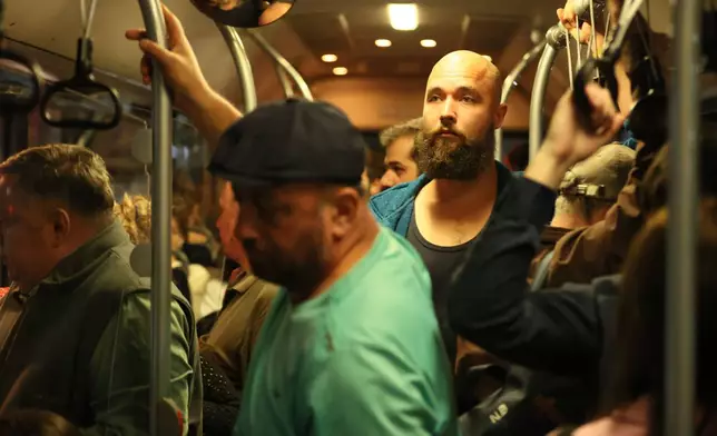 A 28-year-old digital content marketer who recently moved out of Russia rides a subway car in Tbilisi, Georgia, Tuesday, Sept. 8, 2026. He asked not to be identified because of security concerns. (AP Photo/Zurab Tsertsvadze)