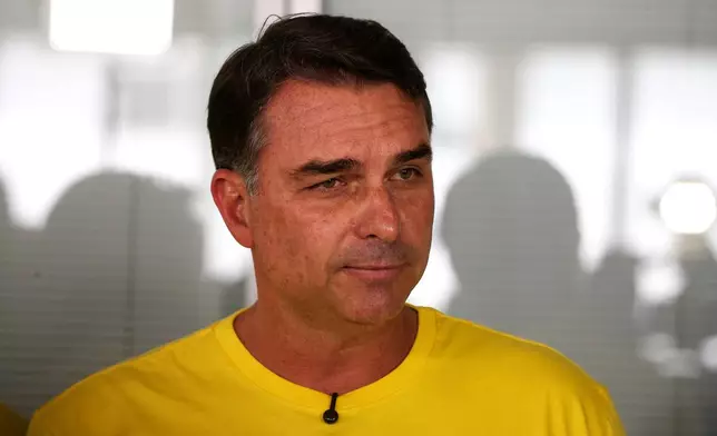 Opposition presidential candidate Sen. Flavio Bolsonaro attends a news conference after visiting a Honda motorcycle factory in the Manaus Free Trade Zone during a campaign event in Manaus, Amazonas state, Brazil, Friday, Sept. 11, 2026. (AP Photo/Edmar Barros)