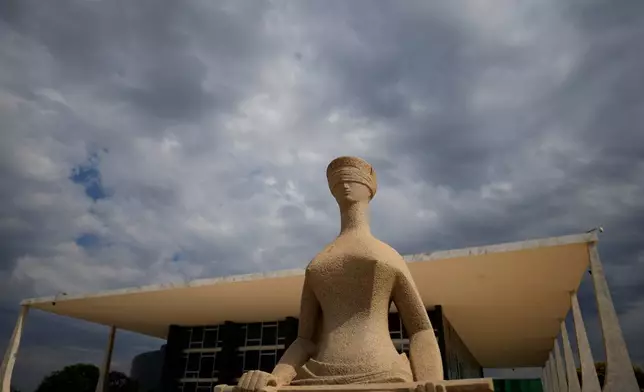The Statue of Justice stands outside the Supreme Court building ahead of a plenary session in Brasilia, Brazil, Wednesday, Sept. 2, 2026. (AP Photo/Eraldo Peres)