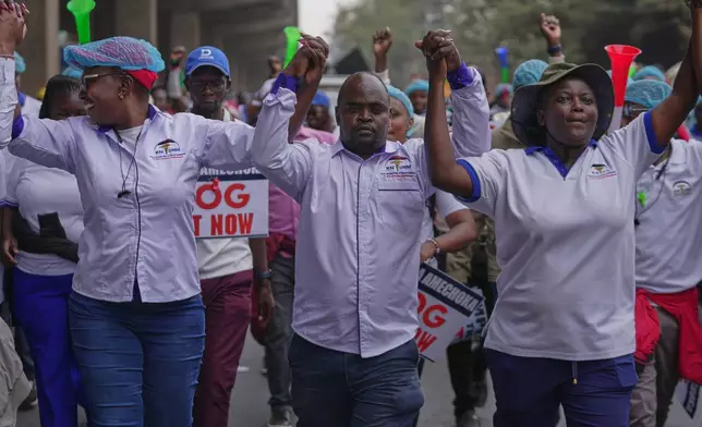 Kenyan nurses and other health workers demonstrate over low pay in Nairobi, Kenya Tuesday, Sept. 8, 2026. (AP Photo/Brian Inganga)