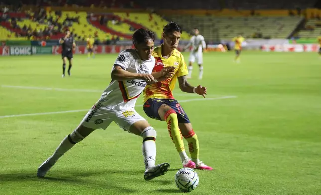 Leones Negros' Jared Escalante, left, and Atletico Morelia's Mauro Nambo vie for the ball during a Mexican second division soccer match in Morelia, Michoacan state, Mexico, Saturday, Sept. 19, 2026. (AP Photo/Armando Solis)