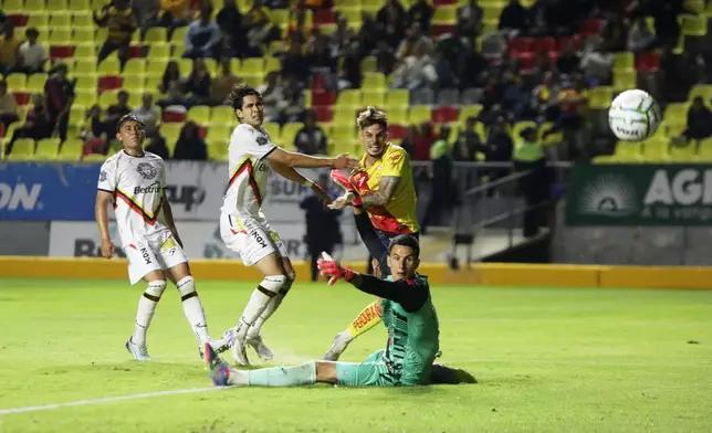 Atletico Morelia's Ruben del Campo, center, scores his side's opening goal against Leones Negros during a Mexican second division soccer match in Morelia, Michoacan state, Mexico, Saturday, Sept. 19, 2026. (AP Photo/Armando Solis)