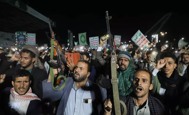 Supporters of Yemen’s Houthi rebels chant and raise rifles during a rally organized to celebrate the group’s capture of Mayun Island in the strategic Bab el-Mandeb Strait, in Houthi-controlled Sanaa, Yemen, Friday, Sept. 11, 2026. (AP Photo/Osamah Abdulrahman)
