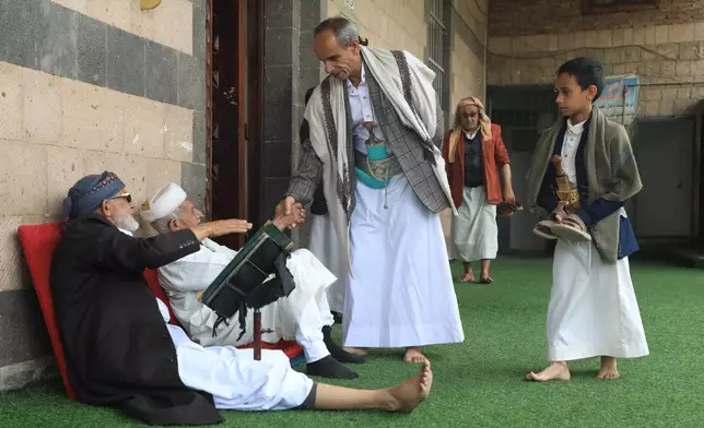 Worshippers greet friends as they enter Al Shamy mosque in Sanaa, Yemen, Friday, Sept. 11, 2026. (AP Photo/Osamah Abdulrahman)