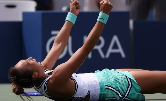 Zheng Qinwen, of China, celebrates after she won her match against Madison Keys, of the United States, during the third round of the U.S. Open tennis championships Saturday, Sept. 5, 2026, in New York. (AP Photo/Heather Khalifa)