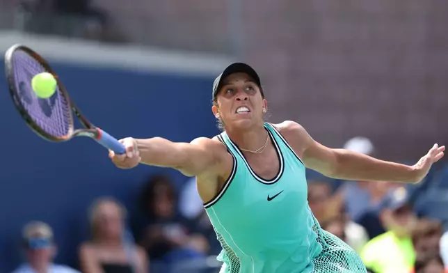 Madison Keys, of the United States, returns the ball to Zheng Qinwen, of China, during the third round of the U.S. Open tennis championships Saturday, Sept. 5, 2026, in New York. (AP Photo/Heather Khalifa)