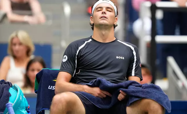 Taylor Fritz, of the United States, sits during a break from play during the third round of the U.S. Open tennis championships against Francisco Cerundolo, of Argentina, Saturday, Sept. 5, 2026, in New York. (AP Photo/Yuki Iwamura)