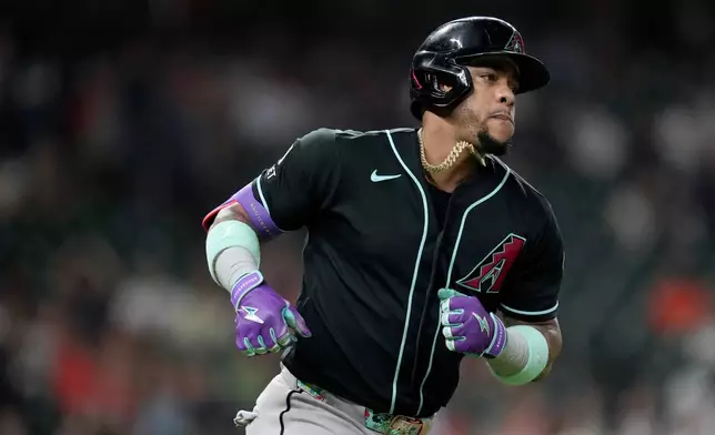 Arizona Diamondbacks' Ketel Marte rounds the bases after hitting a solo home run against the Houston Astros during the eighth inning of a baseball game Saturday, Sept. 5, 2026, in Houston. (AP Photo/Eric Christian Smith)