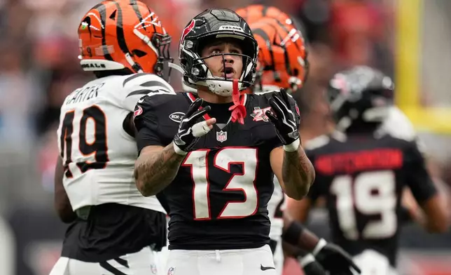Houston Texans wide receiver Jaylin Noel (13) celebrates a first down during the first half of an NFL football game against the Cincinnati Bengalsin Houston, Sunday, Sept. 20, 2026. (AP Photo/Ashley Landis)