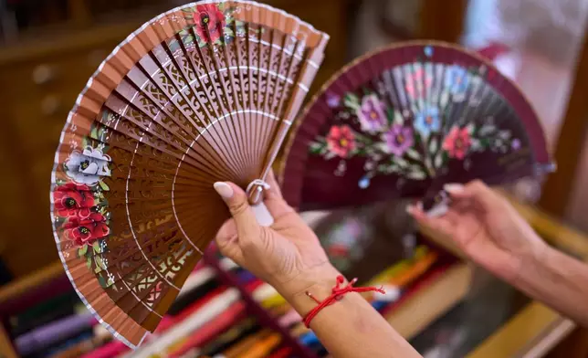 Fans are displayed at Casa Diego, a fan shop in Madrid, Spain, on Aug. 18, 2026. (AP Photo/Manu Fernandez)