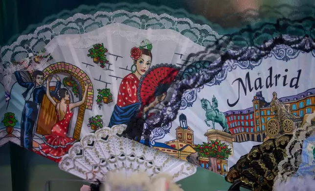 Hand fans are displayed at a souvenir shop in Madrid, Spain, on Aug. 18, 2026. (AP Photo/Manu Fernandez)