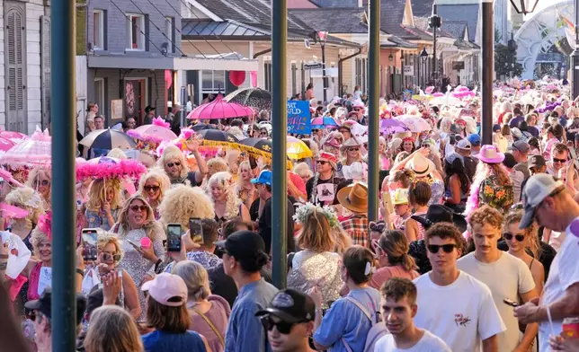 Members of the Krewe of Dolly lead a second line parade in commemoration of the life of Dolly Parton through the French Quarter Friday, Sept. 25, 2026, in New Orleans. (AP Photo/Gerald Herbert)