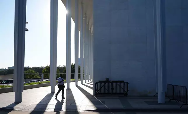 A security official walks outside of the John F. Kennedy Center for the Performing Arts in Washington, Tuesday, Sept. 15, 2026. (AP Photo/Jacquelyn Martin)