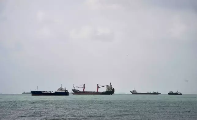 Commercial vessels lie anchored in the Strait of Hormuz off Bandar Abbas, Iran, Friday, Sept. 4, 2026. (AP Photo/Vahid Salemi)