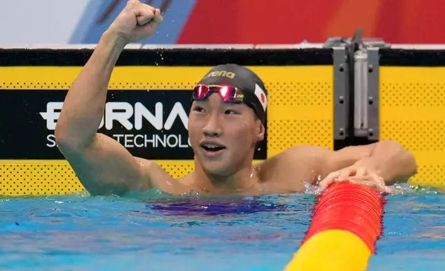 Shin Ohashi of Japan celebrates after winning the men's 200-meter breaststroke final in swimming at the Asian Games in Tokyo, Japan, Thursday, Sept. 24, 2026. (AP Photo/Hiro Komae)